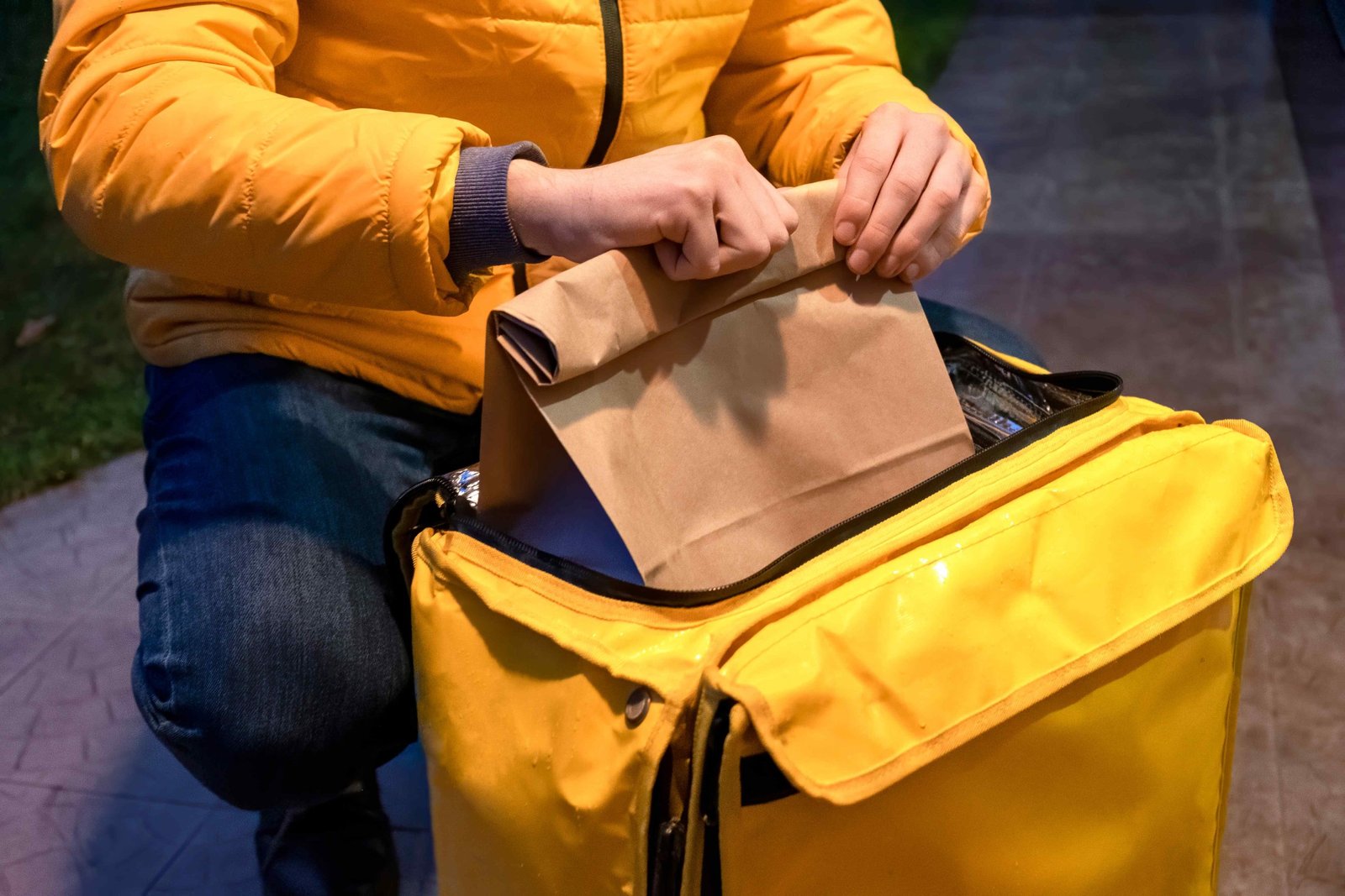 delivery-man-yellow-jacket-opening-yellow-backpack-taking-bag-with-order-11zon